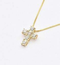 Real Diamond Cross Necklace set with Natural Diamonds, size 2 millimeters each, 0.18 Carats combined.Solid 14k Yellow Gold ☞ made to last.Click here for ☞ Solid Gold Collection**This is a Solid Gold pendant which comes with complimentary '18k Gold Vermeil' chain. For Solid Gold chains, please contact us.Diamond Details:• CERTIFIED Diamond• Weight: 0.18 Carats combined• Dimensions: 2mm each• Cut: RoundSolid Gold Details:• 0.7 grams of 14k Solid Yellow Gold• Dimensions: Length 12.5mm, Width 10mm• Lasts a lifetime - Perfect for everyday use (won’t tarnish)!*Final weight & dimensions depending on the chosen necklaceSKU HC-464 Diamond Cross Necklace, Solid Gold Chains, Diamond Cross Pendants, Gold Diamond Necklace, Diamond Cross, Gold Collection, Real Diamonds, Gold Details, Solid Yellow