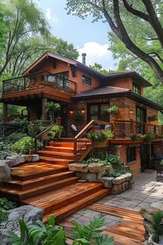 a large wooden house surrounded by lush green trees and plants in front of the stairs