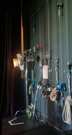 several lights are hanging on the wall in front of a camera set up for an event