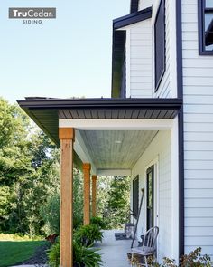 the front porch is clean and ready to be used as an outdoor space for relaxing