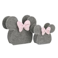 two mouse ears with pink bows on them