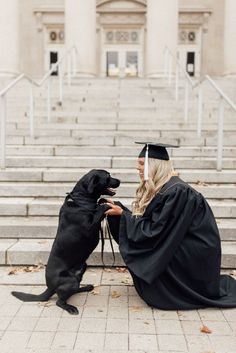 a woman sitting on steps petting a dog wearing a graduation cap and gown with stairs in the background