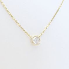 This stunning solitaire necklace is set with a 0.30 carat diamond (G color, SI2 clarity) in a 14k gold bezel setting on a high quality diamond cut cable chain with lobster claw clasp (length of your choice). If you would like a chain length that is not currently an option, just send us a message and we can add it for you. The 0.30 ct. diamond measures appx. 4.35mm in diameter. A SkinnyBling best seller!! Simple yet elegant. The perfect everyday necklace.. a truly classic piece that will NEVER go Everyday Classic Solitaire Necklace With Single Cut Diamonds, 14k White Gold Solitaire Necklace With Vvs Clarity, Everyday Classic Diamond Necklace With Brilliant Cut, 14k Gold Diamond Necklace With Vvs Clarity, Classic 14k Gold Solitaire Necklace With Single Cut Diamonds, Diamond White Necklace With Round Bezel Setting, Diamond White Necklace With Bezel Setting And Round Shape, Diamond White Necklace With Bezel Setting Round, 14k Gold Solitaire Necklace With Round Cut Diamond