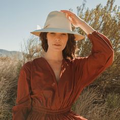 Hand-woven from Paja Toquilla straw and artisan-crafted in Ecuador, this natural straw fedora features a broad brim and an oversized grosgrain band, wrapped asymmetrically around the hat and finished with a modern angular fold. Uv Protection Clothing, Female Owned Business, The Fine Print, Straw Fedora, Air Supply, Fine Print, Beach Blanket, Artisan Craft, Straw Hat