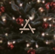 a close up of a christmas tree with the letter a on it's side