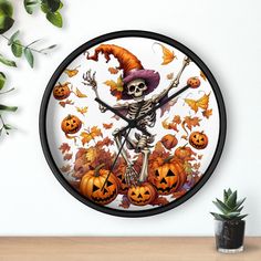 a clock with a skeleton and pumpkins on it