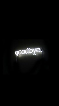 the words goodbye are lit up in the dark, and there is no image to describe