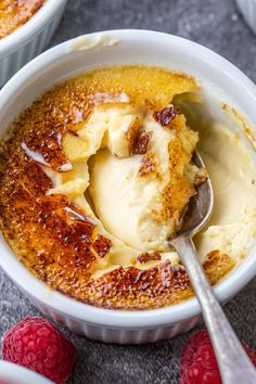 two bowls filled with ice cream and raspberries