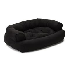 a black dog bed on a white background