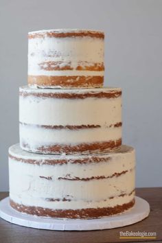 a three layer cake with frosting on top