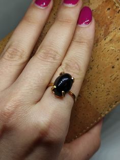 Gift sophistication and strength with our Onyx Ring. This exquisite piece, featuring the timeless beauty of black onyx, make a perfect gift for any occasion. Share the elegance and boldness of this gemstone with someone special, and make their day truly memorable. 🔸Adjustable band 🔸12mm stone size 🔸Color back 🔸Gold filled We offer  🔸Fast shipping ( under normal conditions) 🔸Free shipping  🔸Polishing cloth ( to keep your piece shiny) 🔸Jewelry case on orders of 100€ 🔸Gift box 🎁 🔸Great c Shiny Jewelry, Healing Crystal Ring, Black Onyx Jewelry, January Birthstone Rings, Midi Rings, Onyx Jewelry, Black Onyx Ring, Onyx Ring, Jewelry Case