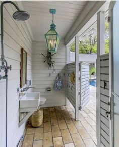 the bathroom is decorated in shades of blue and white, with an open door leading to another room