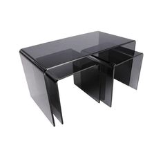 a black glass table with two drawers underneath it