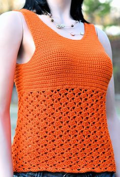 a woman wearing an orange crochet tank top