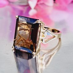 Welcome to our Etsy store 💕 Discover the beauty of our Natural Smoky Quartz ring, meticulously crafted in 14k Solid Gold. Smoky Quartz, also known as Smoky Topaz, is often considered an alternative birthstone for November. Historically, smoky topaz has been used as a protective stone. It is thought to absorb negative energy and transform it into positive energy, shielding the wearer from harm and emotional disturbances. 11.60 Carat Natural Smoky Quartz Ring In 14k Solid Gold Available in 14k Solid Yellow, White and Rose Gold Stamped: 14K Total Ring Weighs 4.6 Carat  Topaz Weight: 11.60 Carat (16.00x12.00 Millimeters)  Topaz Cut: Emerald Topaz Treatment: Heat Treated Topaz Clarity: Eye Clean Approx. Face Measures: 16.00x12.00 Millimeters Made in the USA Comes in a nice jewelry box 🎁 If yo Energy Shielding, Smoky Quartz Ring, Nice Jewelry, Smoky Topaz, November Birthstone, 14k Gold Ring, Quartz Ring, Fine Jewelry Gift, Anniversary Ring