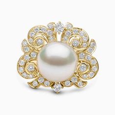 Embrace the essence of divine grace with this celestial ring, meticulously crafted in 18K Yellow Gold. Adorned with resplendent 12-13mm Australian South Sea Pearls, delicately surrounded by diamonds, evoking the timeless allure of the desert sand. Witness the mesmerizing interplay where the pearl is embraced by the luminous allure of round-cut diamonds, creating a silhouette reminiscent of graceful dunes. Pair with the matching necklace and earrings for a truly enchanting ensemblePearl Size: 12-13 mmDiamond Weight: 0.97ctsMetal: 18K Yellow Gold
Ring Sizing Information: For additional ring sizes, please click “make an enquiry” above and send us a message. A member of our team will get back to you within one working day. Pearl Diamond Ring, Rare Pearls, Diamond Rings With Price, Celestial Ring, Divine Grace, Pearl And Diamond Ring, Pearl Jewellery, Yoko London, Desert Sand