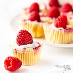 raspberry cupcakes with whipped cream and fresh raspberries