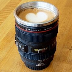 a coffee cup with a camera lens in it