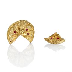 Cast directly from dried lemon slices, these gold and red earrings make the freshest statement piece. Each piece is made exclusively by hand, and will therefore have its own unique characteristics. Treat your earrings with care. 22K Gold-plated Brass, Red Cubic Zirconia, 18K Gold Earring Posts Gold And Red Earrings, Lemon Seeds, Arrow Earrings, Gold And Red