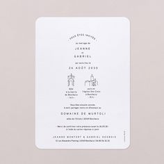 a white wedding card with the wording in black and white on it's front