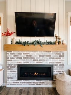 a fireplace with a flat screen tv above it