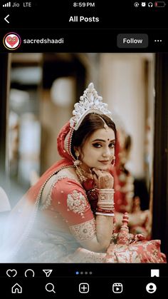 a woman wearing a red and white bridal outfit