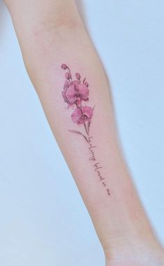 a small pink flower on the arm with words written below it that says, i love you