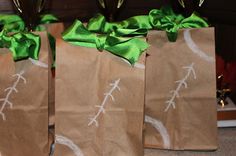 three brown bags with green bows and arrows drawn on them are sitting on the floor