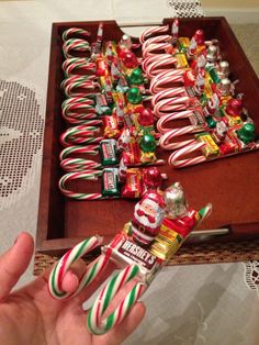 candy canes and candies in a wooden box