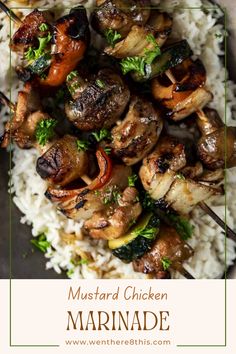 chicken and vegetable kabobs served over rice on a plate