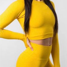 Alphalete Revival Long Sleeve Crop Top In The Color Yellow. Size Medium Never Worn Yellow Stretch Long Sleeve Top, Sporty Long Sleeve Yellow Top, Fitted Yellow Seamless Crop Top, Fitted Yellow Crop Top With Built-in Bra, Yellow Sleeveless Crop Top With Built-in Bra, The Color Yellow, Hack Tool, Long Sleeve Crop, Long Sleeve Crop Top