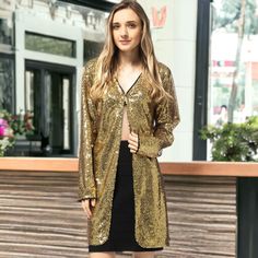 Make a statement with the Anna-Kaci Women's Sequin Open Front Cocktail Outerwear Jacket, a sophisticated and eye-catching piece perfect for any occasion. This shiny disco jacket boasts an open front with hook & closure and long sleeves, ensuring you'll stand out wherever you go. Chic Sequined Cardigan For Fall, Trendy Gold Outerwear For Party, Trendy Gold Party Outerwear, Long Sleeve Blazer For Parties, Glamorous Winter Cardigan For Night Out, Gold Long Sleeve Blazer For Winter, Chic Gold Long Sleeve Outerwear, Chic Long Sleeve Sequined Cardigan, Glamorous Fitted Long Sleeve Blazer