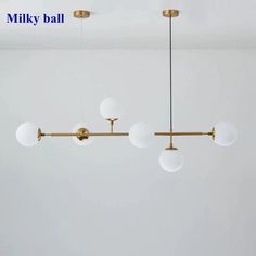 an image of a ceiling light fixture with five lights hanging from it's sides