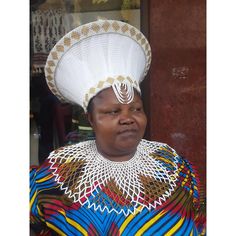 This 3 in 1 set includes: A gold and white beaded scepter or stick A gold and white beaded necklace. A double framed gold and white zulu hat that is embelished with gold and white beads The White Zulu Hat that is embelished with Gold and White beads is called ISICHOLO in traditional Zulu language and is traditionally worn during religious and cultural ceremonies. by the married Zulu woman of South Africa. The form of the isicholo, or married woman's hat, developed out of a 19th-century conical hairstyle that was worn as a sign of respect to one's husband and his family, in addition to serving as a public symbol of married status. In the early 20th century, a removable hat like this one replaced the hairstyle. This zulu accessory will make an amazing gift for a friend or partner. If you wou Traditional White Wedding Hat, Traditional White Hat For Festival, Traditional White Festival Hat, Handmade White Headpieces For Ceremonial Events, White Traditional Festival Hat, Traditional White Ceremonial Headpiece, Traditional White Ceremonial Hat, Black And Gold Zulu Traditional Attire, Ceremonial White Handmade Headpieces