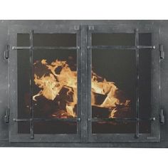 a fire burning inside of a metal door