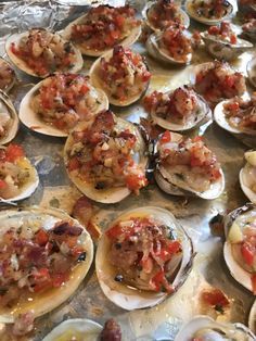 many open oysters are on the table ready to be eaten