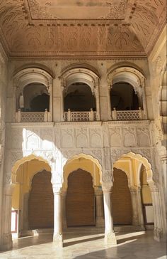 the inside of an ornate building with arches and doorways