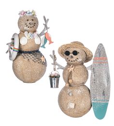 two snowmen are standing next to each other with surfboards in their hands and one has a hat on his head