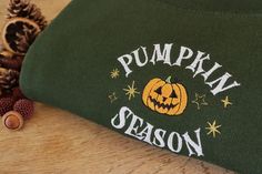 Handmade embroidered Pumpkin Season design onto a unisex sweatshirt, perfect for those chilly autumn days! Past customers have worn this for cute pumpkin picking photos or it makes a great subtle Halloween sweatshirt! ✯PRODUCT DETAILS✯ ✯ECO SWEATSHIRT✯  Currently only available in Size Small, Medium and Large  The eco sustainable sweatshirt is made to a very high quality, it's crafted from premium organic and recycled fabrics.  It's 350gsm (so nice and thick) and the inside is a super soft brush Green Embroidered Fall Hoodie, Green Hoodie With Letter Embroidery For Fall, Fall Cotton Sweatshirt With Embroidered Patch, Embroidery Fall, Embroidered Pumpkin, Clothing Embroidery, Cozy Halloween, Cold Autumn, Autumn Clothing