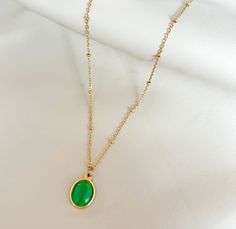 GOLD GREEN CATS EYE PENDANT NECKLACE This DARA GOLD GREEN CATS EYE PENDANT NECKLACE adds a touch of natural beauty to any outfit. The striking green cats eye oval pendant is eye-catching and unique, while the sparkly satellite chain adds a touch of sparkle. Plus, it's waterproof and can be layered with your other favorite chains for a personalized look. Materials: stainless steel, 18K gold plated, green cats eye stone Measurement: necklace length 16” extension length 2”. Total length 18” Pendant Cats Eye Stone, Oval Pendant, Recycled Gold, Cat Eye, Free Jewelry, Necklace Lengths, 18k Gold, Gold Plate, Sparkle