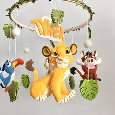 a mobile with stuffed animals hanging from it's sides