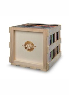 a wooden box with cd's in it