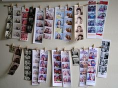 many pictures are hanging on a clothes line with clothes pins attached to them and pinned to the wall