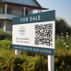 a real estate for sale sign in front of a house with a qr code on it