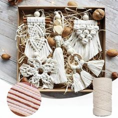 an open box filled with tassels and other items on top of a wooden table