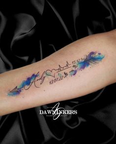 watercolor feather tattoo on the arm with words written in cursive writing and an arrow