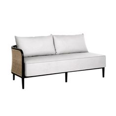 a white couch with two pillows on it's back and one arm folded up