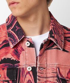 This cotton denim jacket from the SS23 collection by Rassvet is practical and eye-catching, and is characterized by the all-over print in different shades of pink and purple, with black accents that emphasize the contrast. The jacket also features four front pockets and a pair of button straps at the hem for a snug fit. Trendy Cotton Outerwear With Floral Print, Pink Cotton Outerwear For Streetwear, Casual Printed Cotton Outerwear, Casual Cotton Printed Outerwear, Trendy Pink Cotton Denim Jacket, Pink Denim Jacket For Spring Streetwear, Cotton Outerwear With All Over Print For Fall, Multicolor Cotton Denim Jacket With Pockets, Red Spring Outerwear With Graphic Print