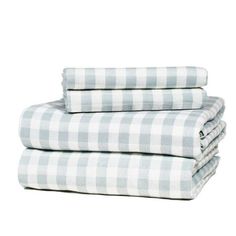 three sheets folded on top of each other in blue and white checkered linens