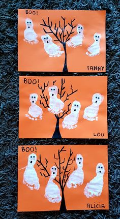 three orange paper plates with pictures of owls on them, and the words boo in white